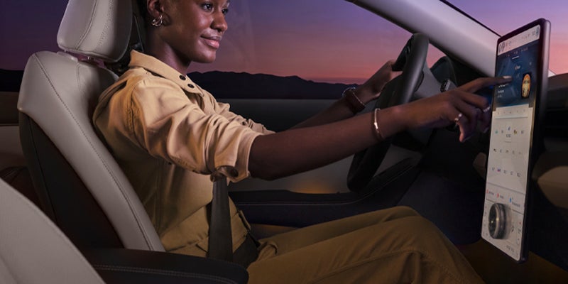 women seating on driving seat