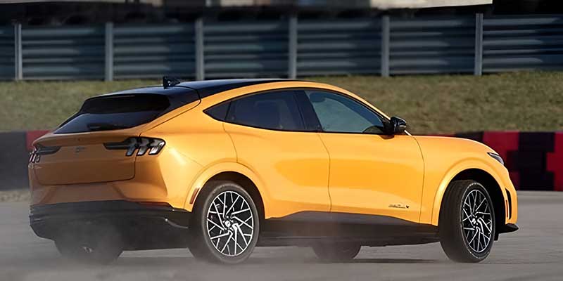 Yellow Ford Mustang Mach-E on a track