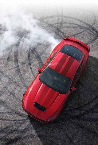 Overhead view of a 2024 Ford Mustang® model with tire tracks on pavement | Winslow Ford in Winslow AZ
