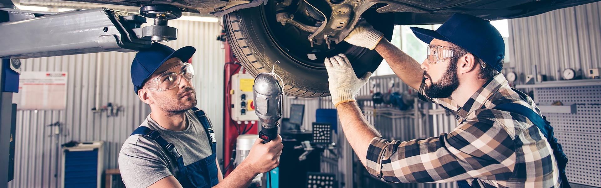 Service Technician Working On Tire Alignment